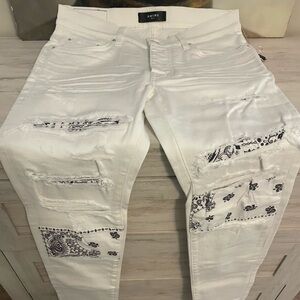 AMIRI White and Black Distressed Skinny Jeans